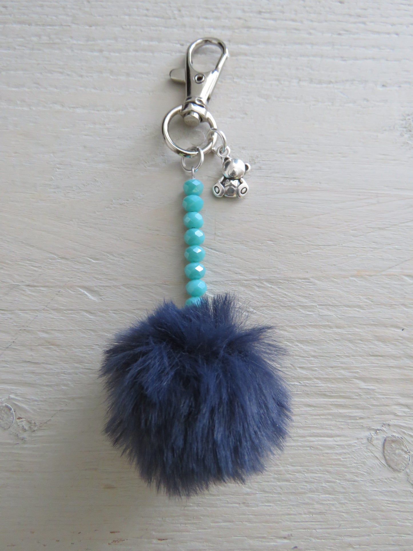 Sleutel-/tashanger Pompon