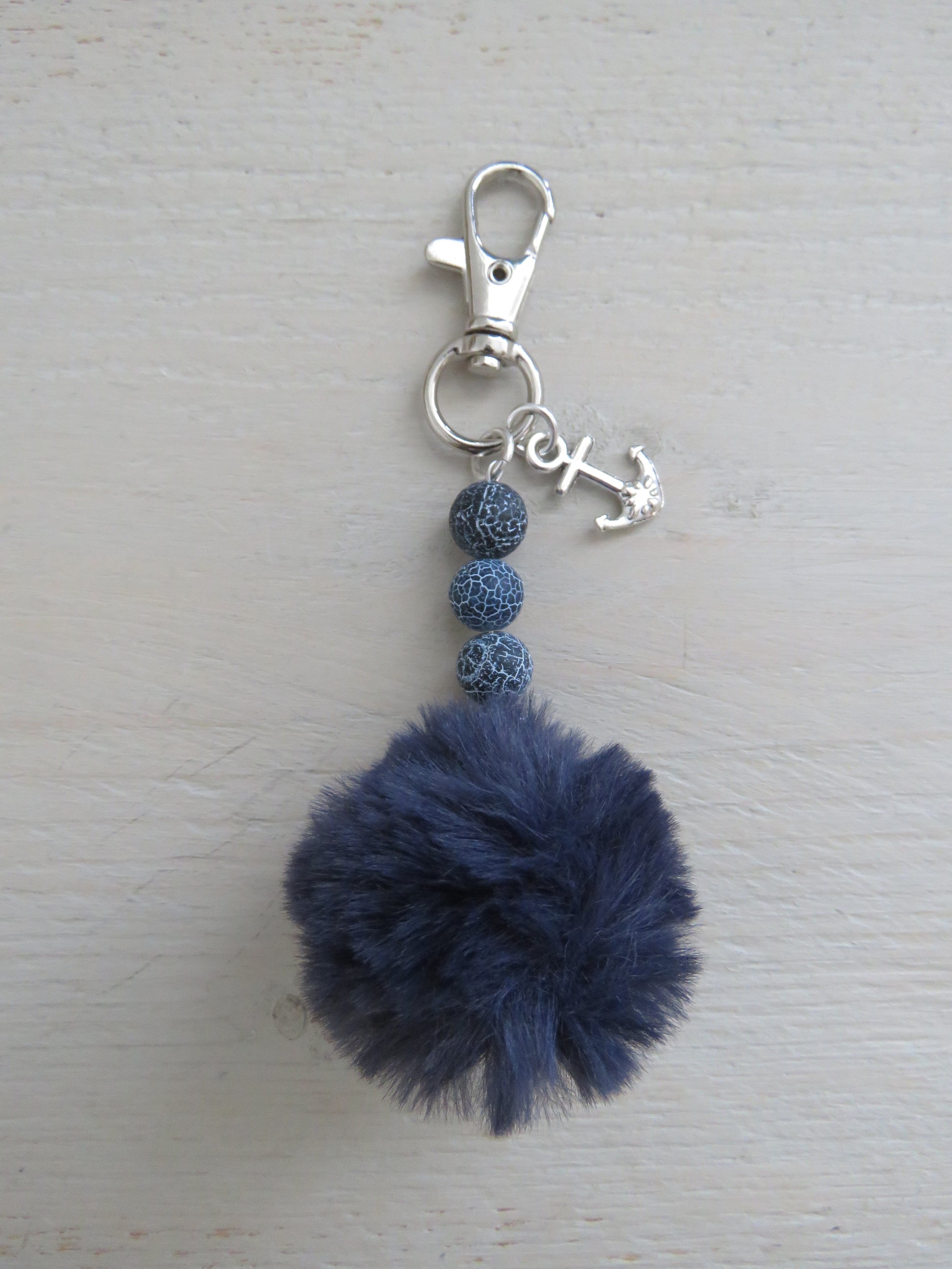 Sleutel-/tashanger Pompon
